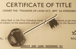 certificate of title with antique silver key