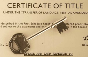certificate of title with antique silver key